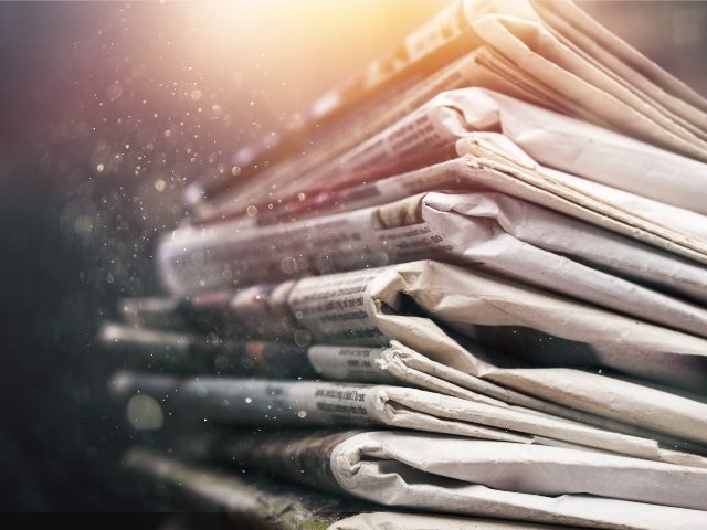 A stack of newspapers.