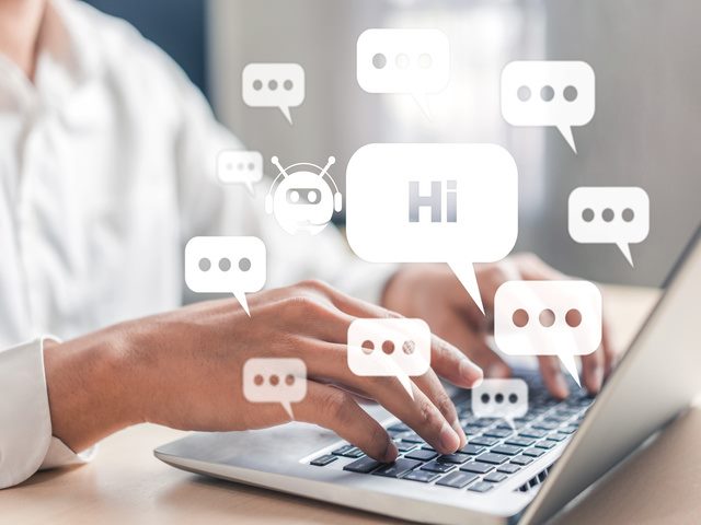 A person on a laptop  interacting with an AI customer service chatbot 