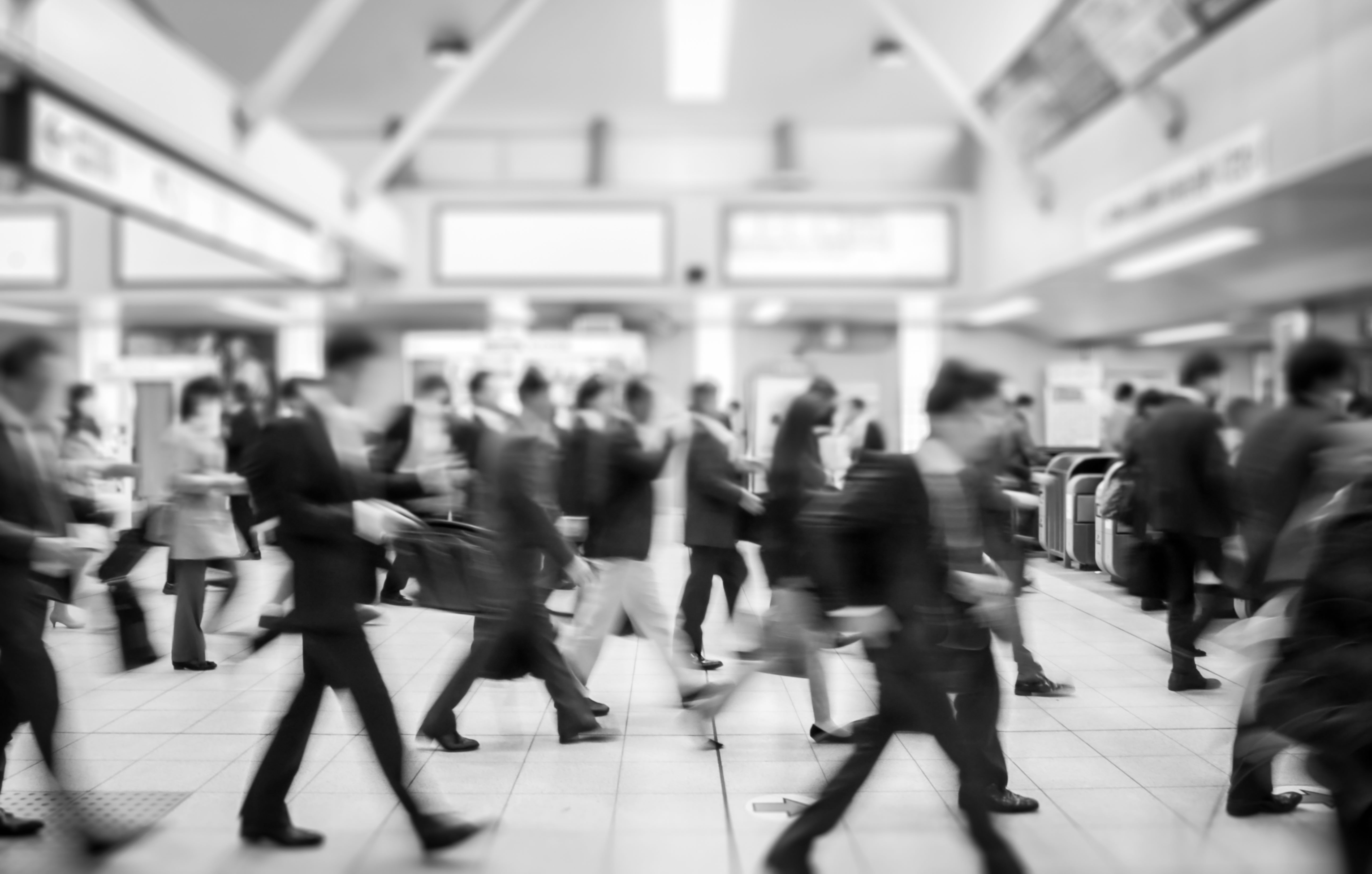 people walking in a subway station