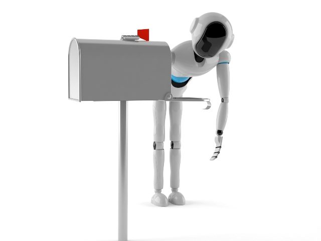 A standard gray/silver mailbox stands to the left with its red flag in the up position and an white android robot leans over with one hand reaching into the mailbox on the right. 