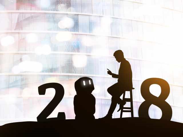 a silhouette of 2018 with a man on his mobile device and a robot