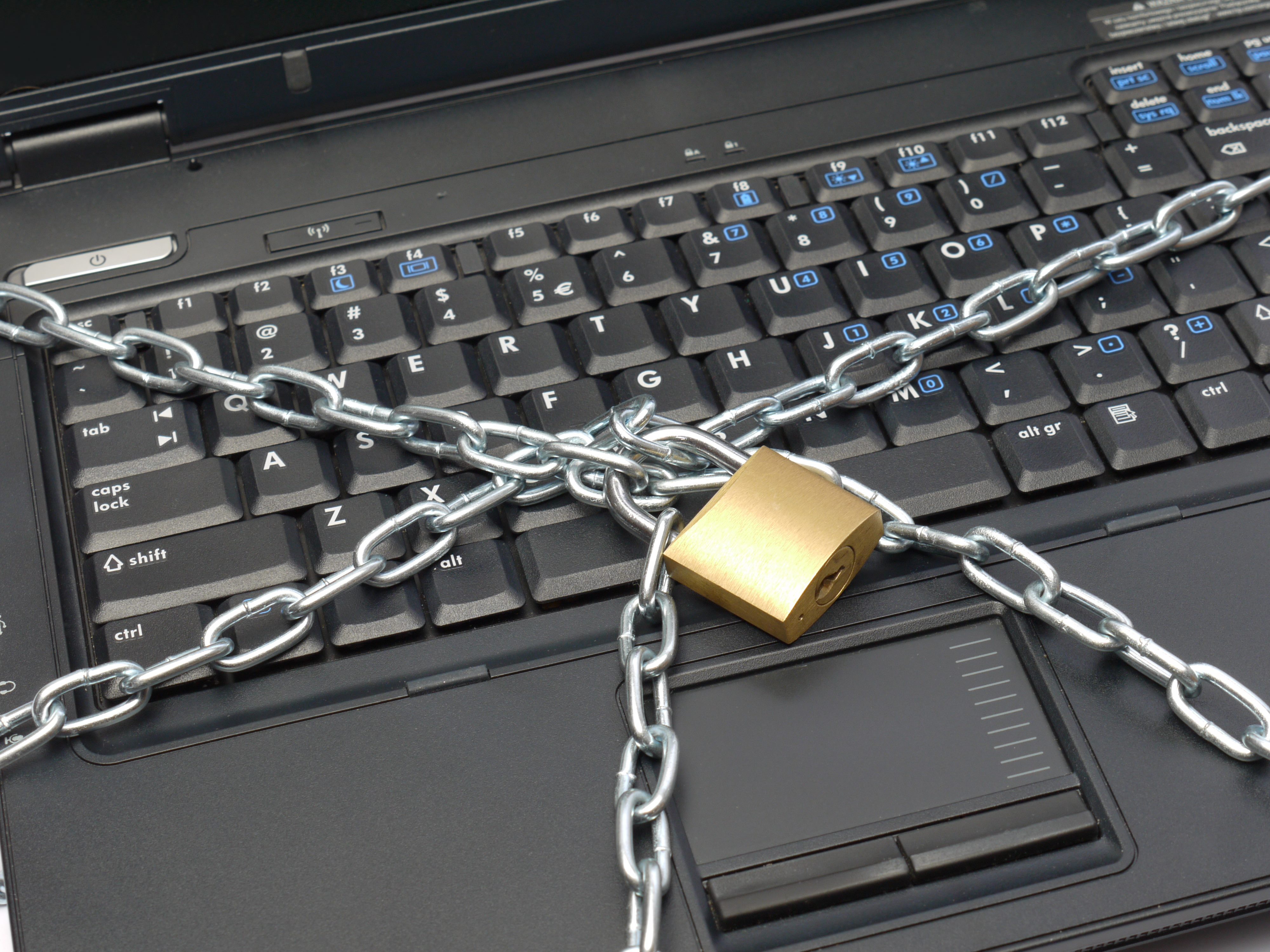 A chained laptop with a lock