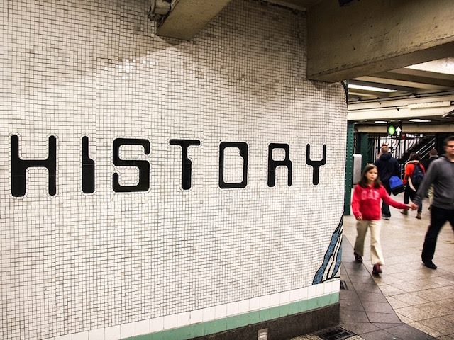history written on a wall in a subway