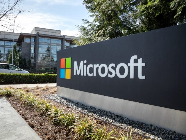 Microsoft headquarters in Redmond, Washington, with Microsoft and logo on a wall.