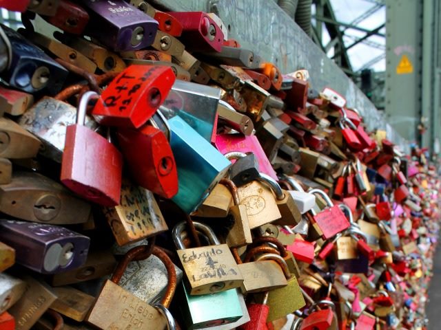 a lot of locks on a fence