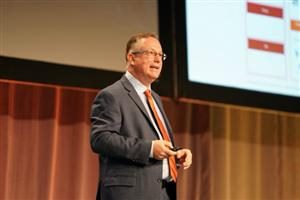Scott Brinker on stage giving his keynote Tuesday at the MarTech conference in Boston.