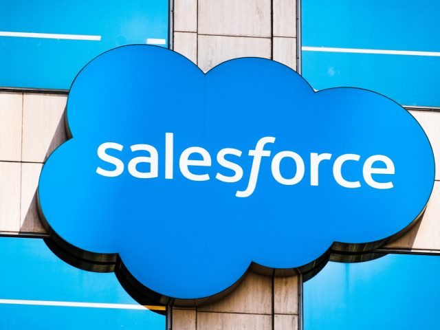 Salesforce logo on a sign on the side of a building