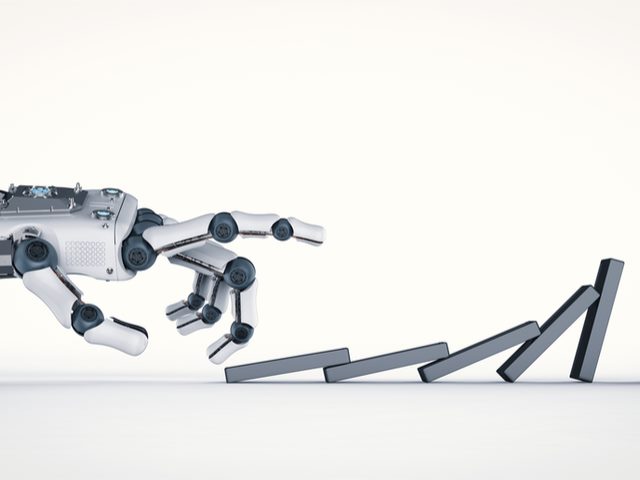 AI/Robotic hand knocking down a domino, causing a cascading effect