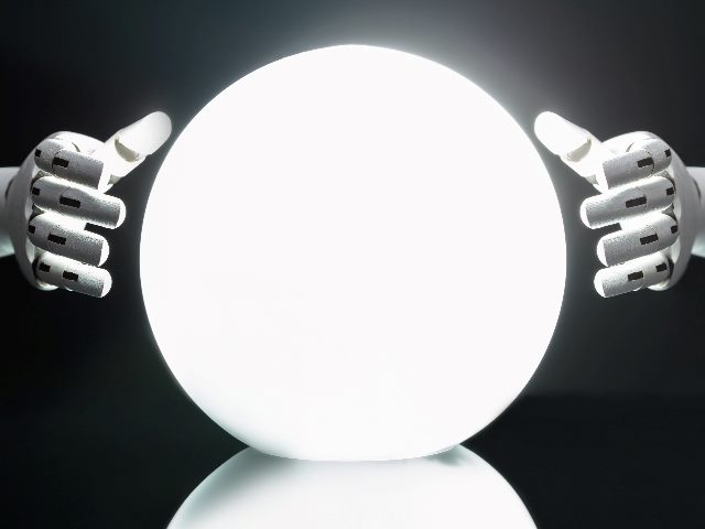 Robot hands surround a large white crystal ball as if the robot is predicting the future in piece about technology predictions for 2024.