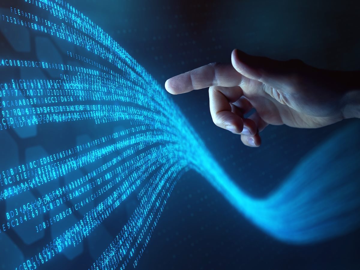 person touching data flowing on virtual screen
