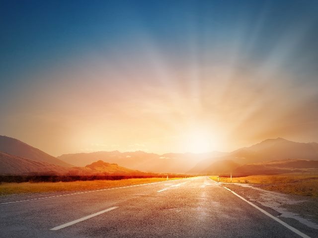 Sunrise above road, signaling what marketers can expect in 2024 from AI marketing tools. 