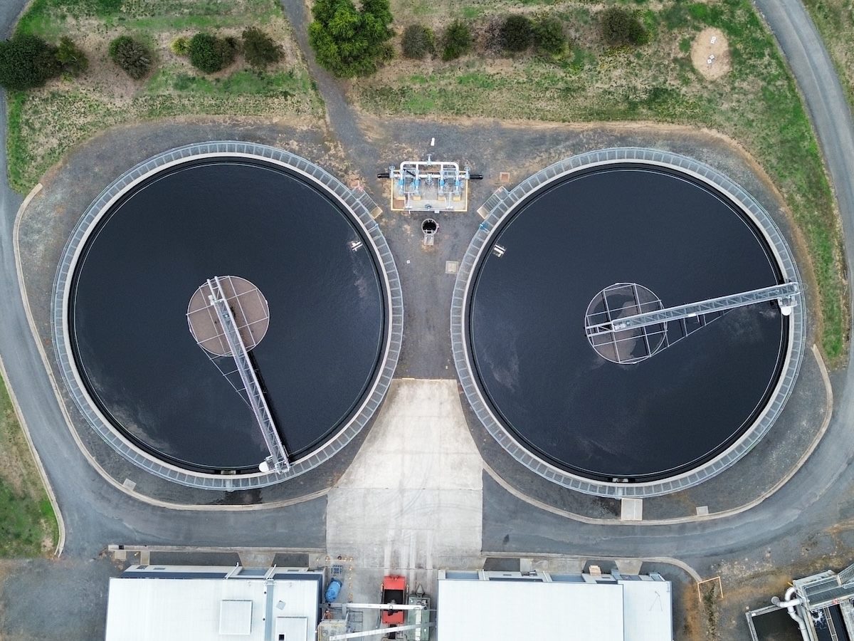 Aerial top down view of circular wastewater treatment tanks