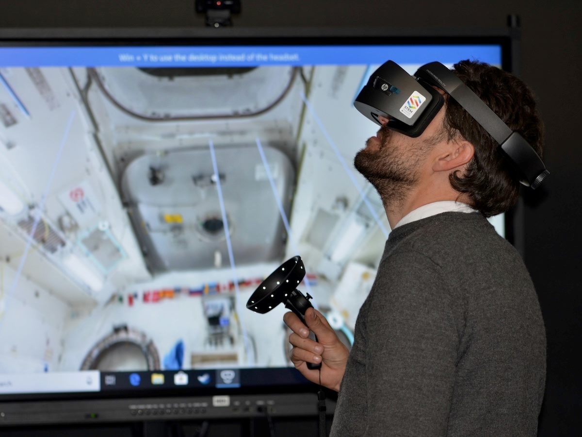 man wearing a VR headset to participate in a simulation