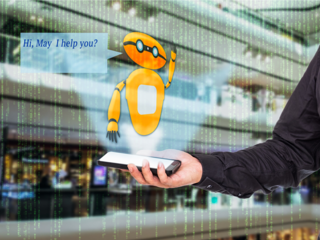 An augmented reality chatbot for office workers coming from a smart phone being held by a businessman