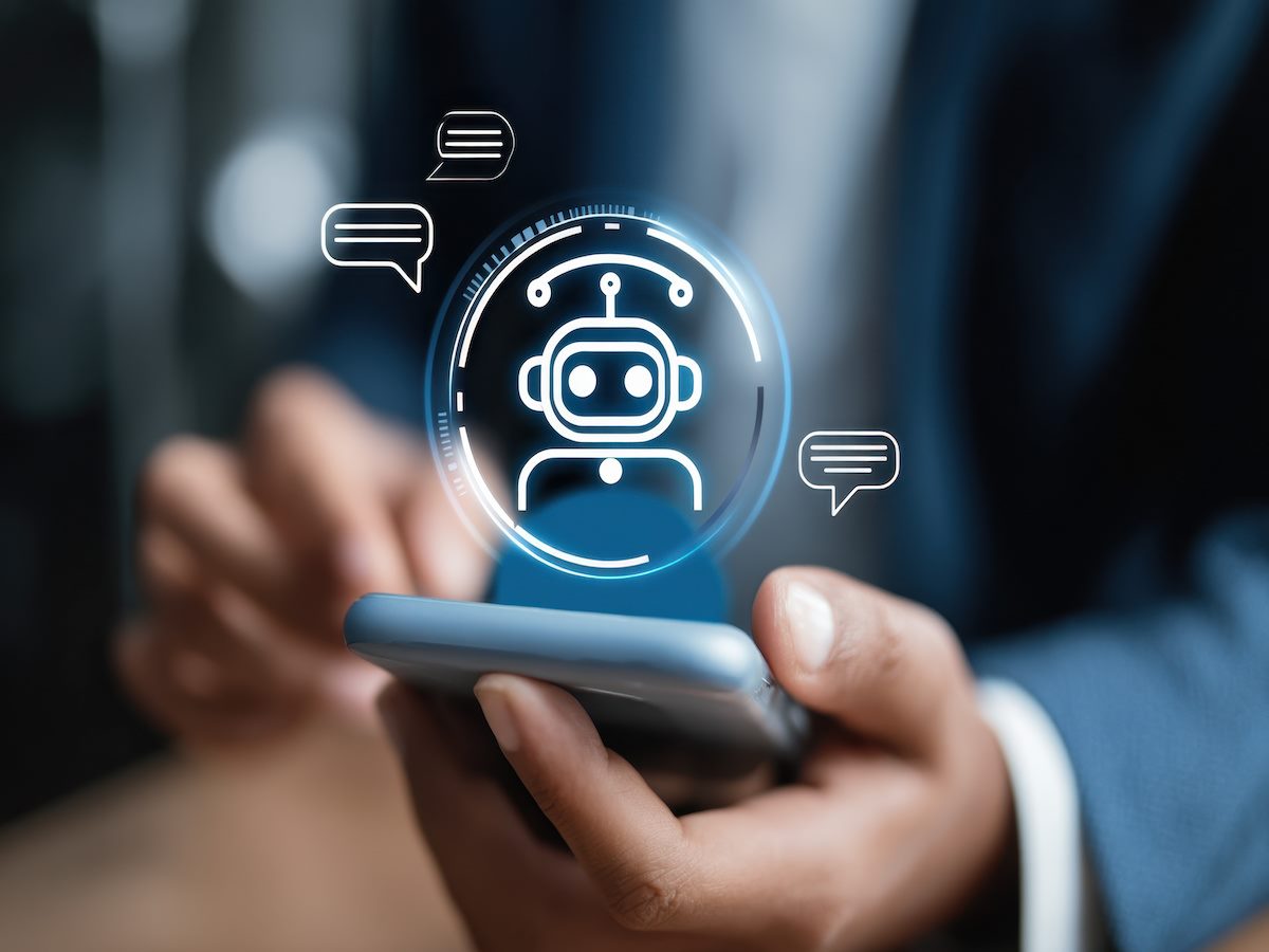 Man chatting with digital assistant chatbot on mobilephone