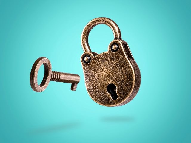 An antique bronze pad lock and skeleton key appear to levitate on an azure background suggesting the issue of data privacy's impact on targeted advertising. 