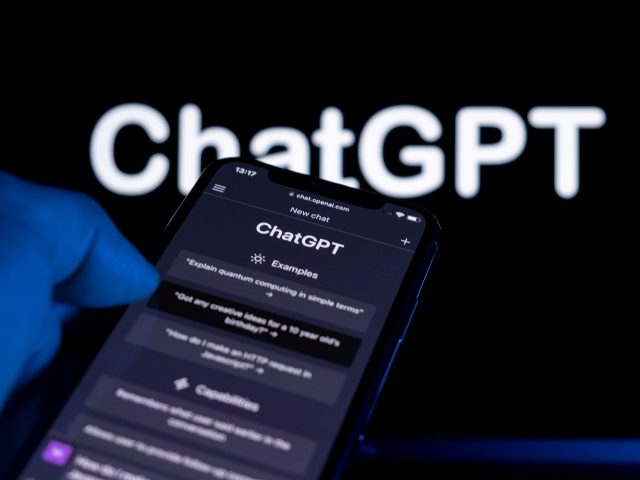 Smartphone screen with OpenAI ChatGPT webpage on it.