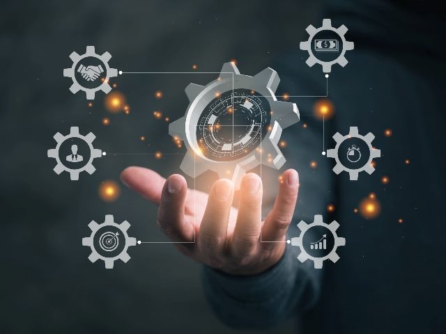 Man holding gears with workflow automation