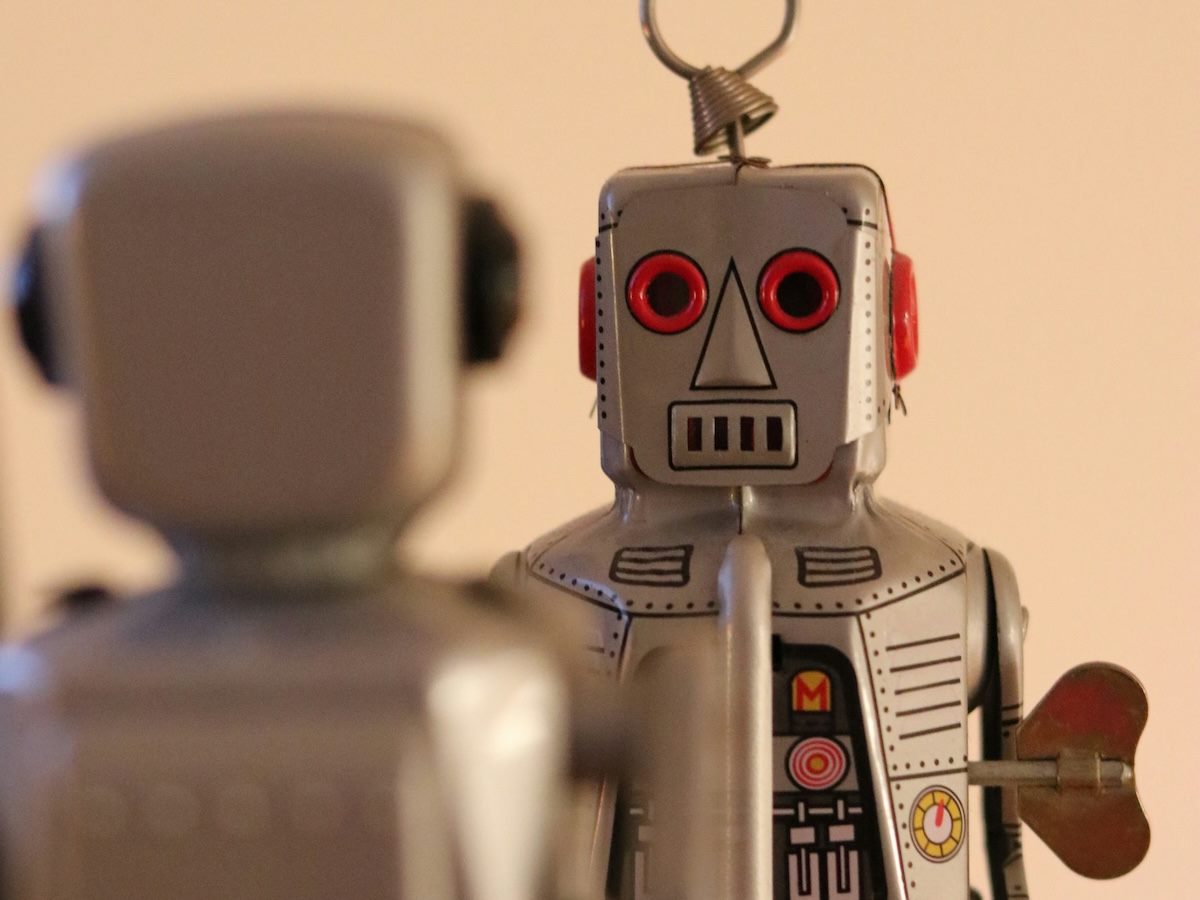 robot toy facing another robot toy