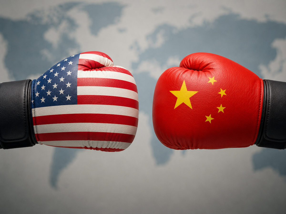Two hands with boxing gloves, one with the USA flag design, the other with the Chinese flag design