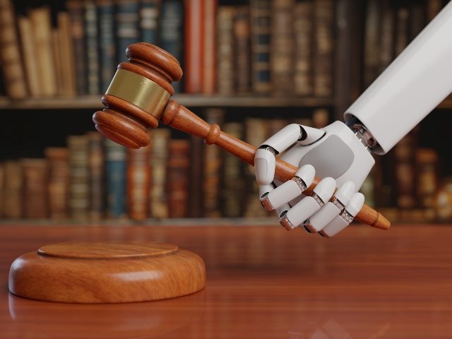 Robotic arm with a gavel.