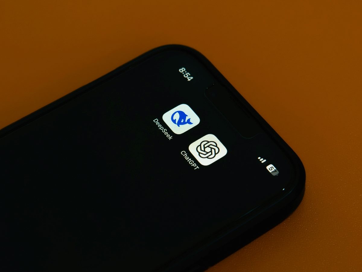 Mobile phone home screen showing AI apps DeepSeek and ChatGPT.