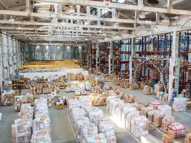  Storage products in large warehouse room ready to be shipped.