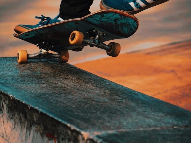 close up of a skateboarder grinding