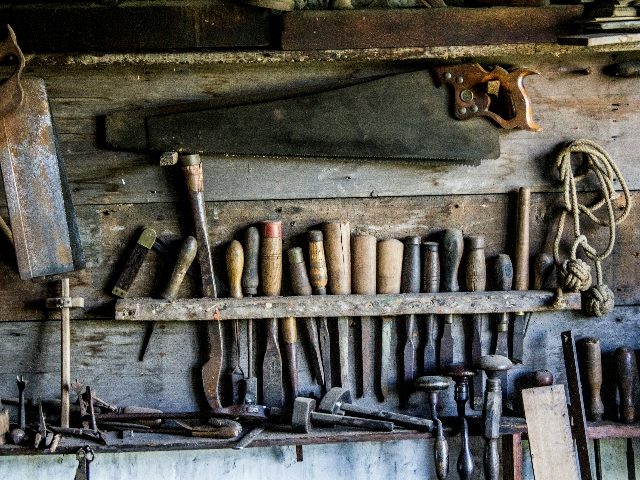 Tools lined up on a wall.