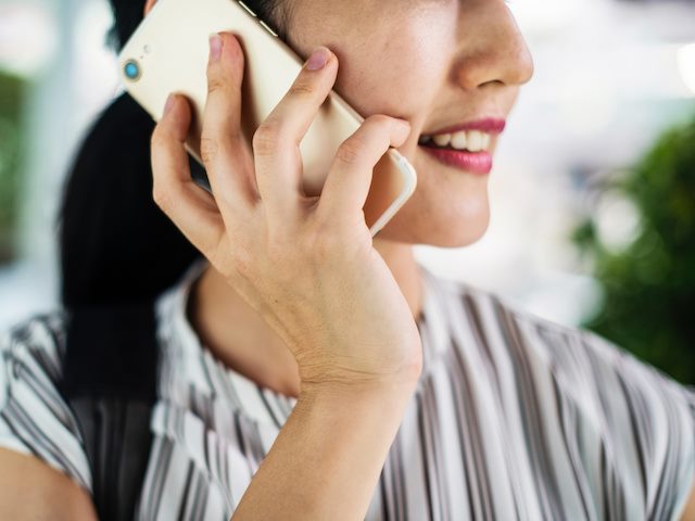 woman speaking on a smartphone