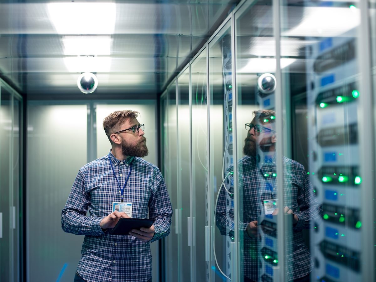 IT engineer with tablet in server room