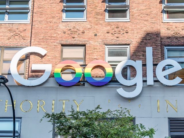 Google logo in exterior of a Google headquarters building in New York. 