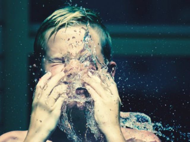 water balloon burst in a boy's face