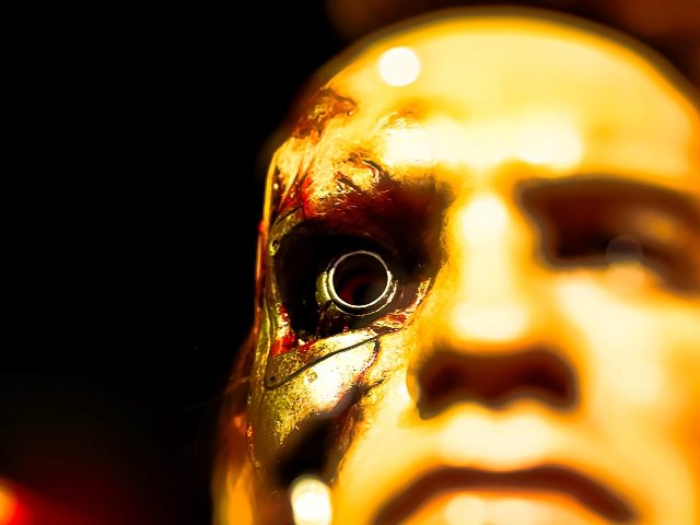 A wax figure of Arnold Schwarzenegger as "The Terminator" depicting the famous scene with his robotic eye visible. 