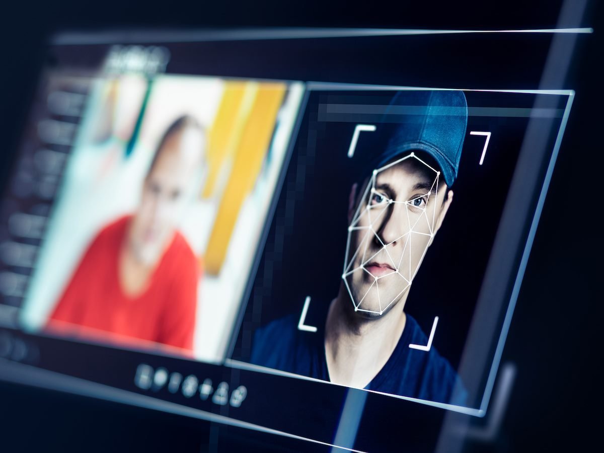 Face recognition and photo editing software on a screen showing the making of a deepfake