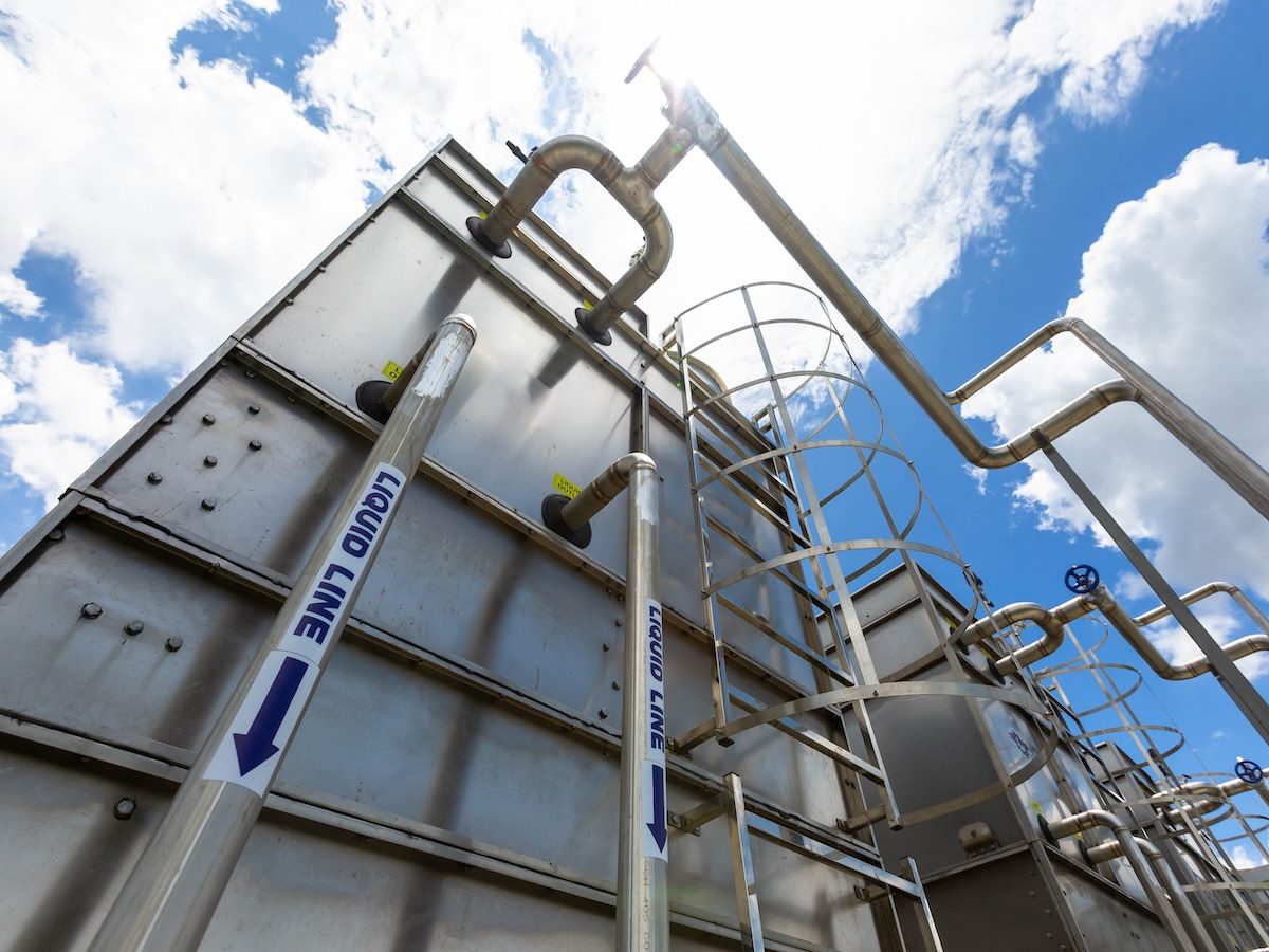 Sets of cooling towers in data center building