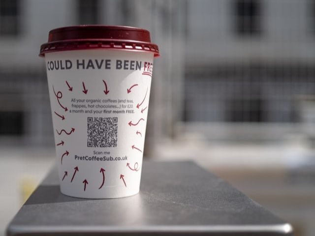 A QR code on a coffee cup