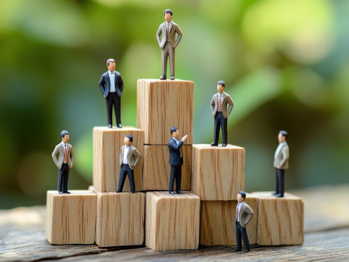 Toy figures of men standing on blocks