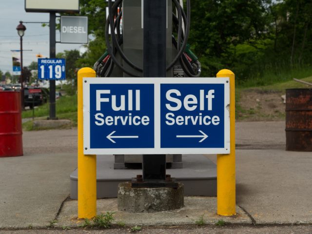 photo of full and self service pumps at a gas station