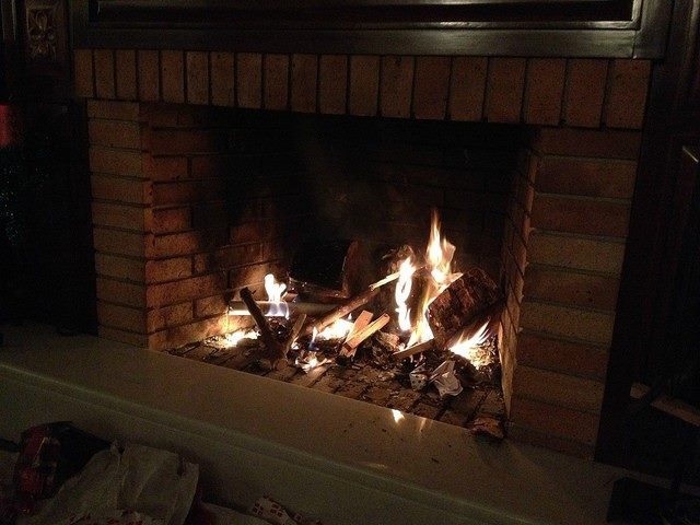 Fireplace that is on and burning.