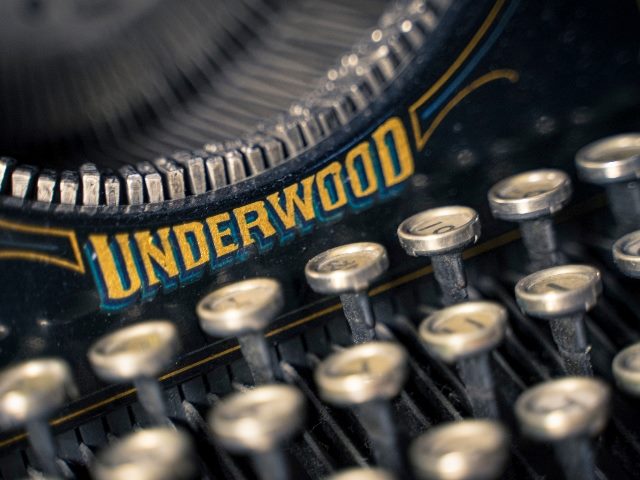 Keyboard and keys of vintage legendary Underwood No. 5 typewriter in piece about NLP and NLU. 