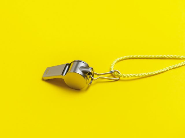 sports whistle on a yellow background