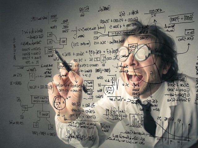 mad scientist type writing formulas on a clear surface