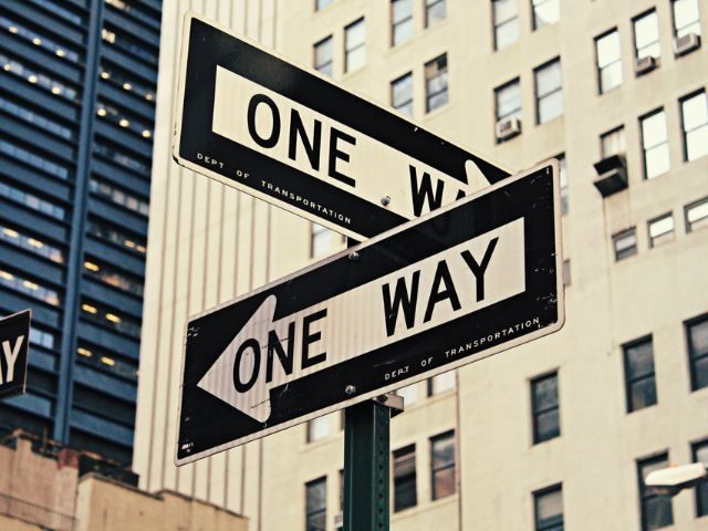 Two "One Way" street signs