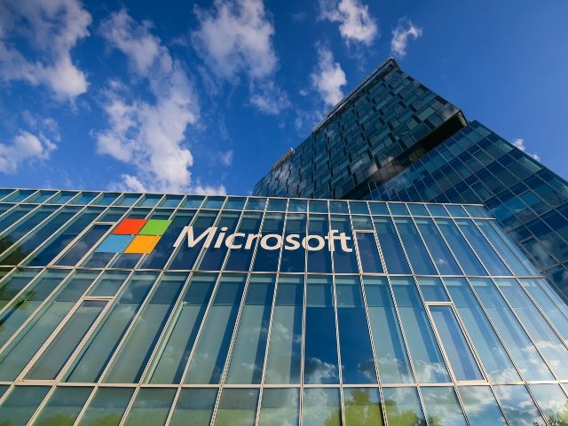 Logo of Microsoft company on a building at office building in Bucharest, Romania.