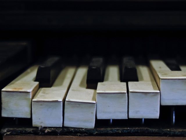 close up of broken piano keyboard
