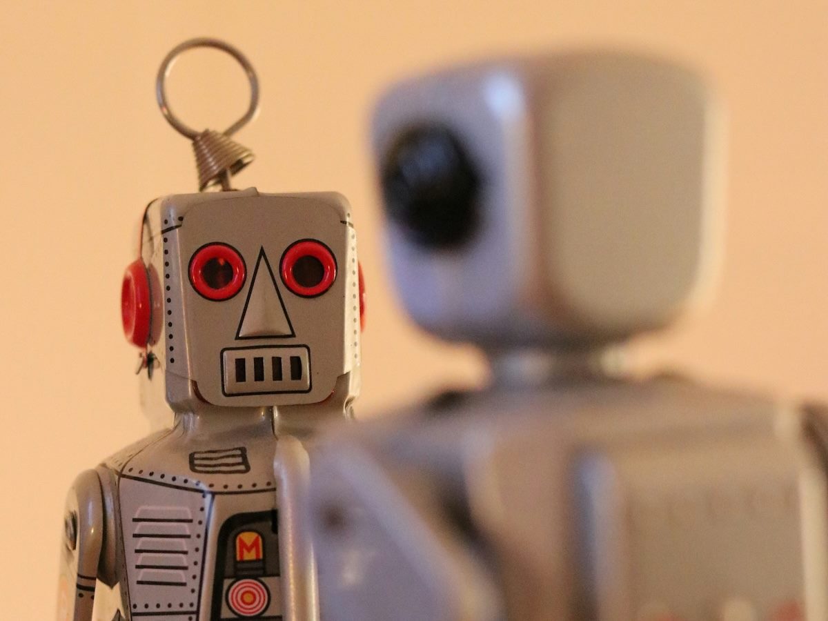two toy robots facing each other