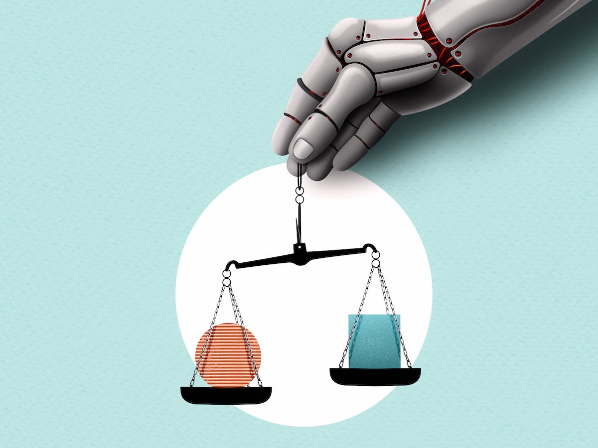 A robot hand holding the scales of justice