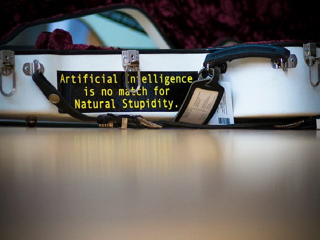 artificial intelligence sign over a locked briefcase