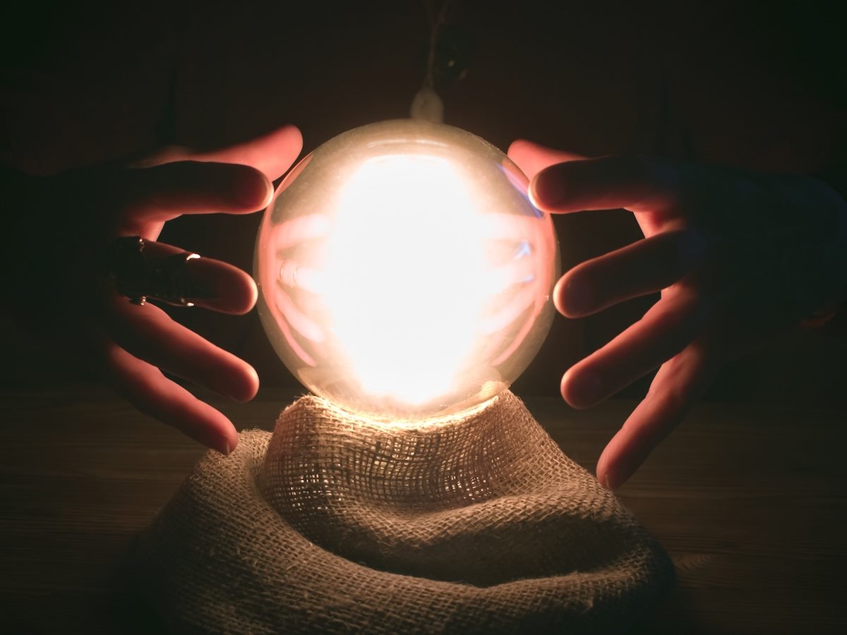 Hands around a crystal ball